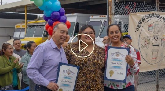Group photo of Councilmember with vendors holding certificates at Cypress Park Commissary grand opening