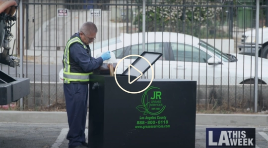 JR Grease Services worker pouring oil into fats, oils, and grease container
