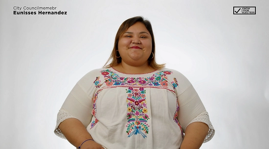 Councilmember Eunisses Hernandez smiling wearing embroidered flower blouse