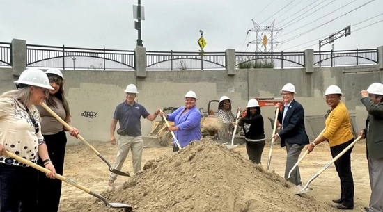 Councilmember Hernandez holds shovel with group of NELA stakeholders as they break ground on the second phase of Northeast New Beginnings.