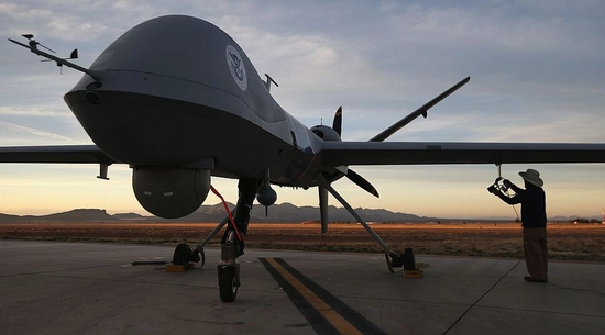 John Moore|Getty Images  A maintenance worker inspects a predator drone before a surveillance flight near the U.S.-Mexico border.